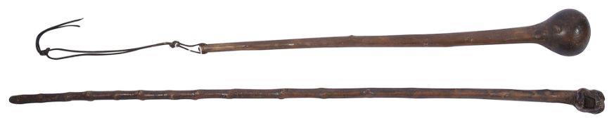 A late 19th C. carved dog head walking stick and a blackthorn shillelagh