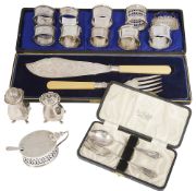 A collection of silver cruet items and napkin rings