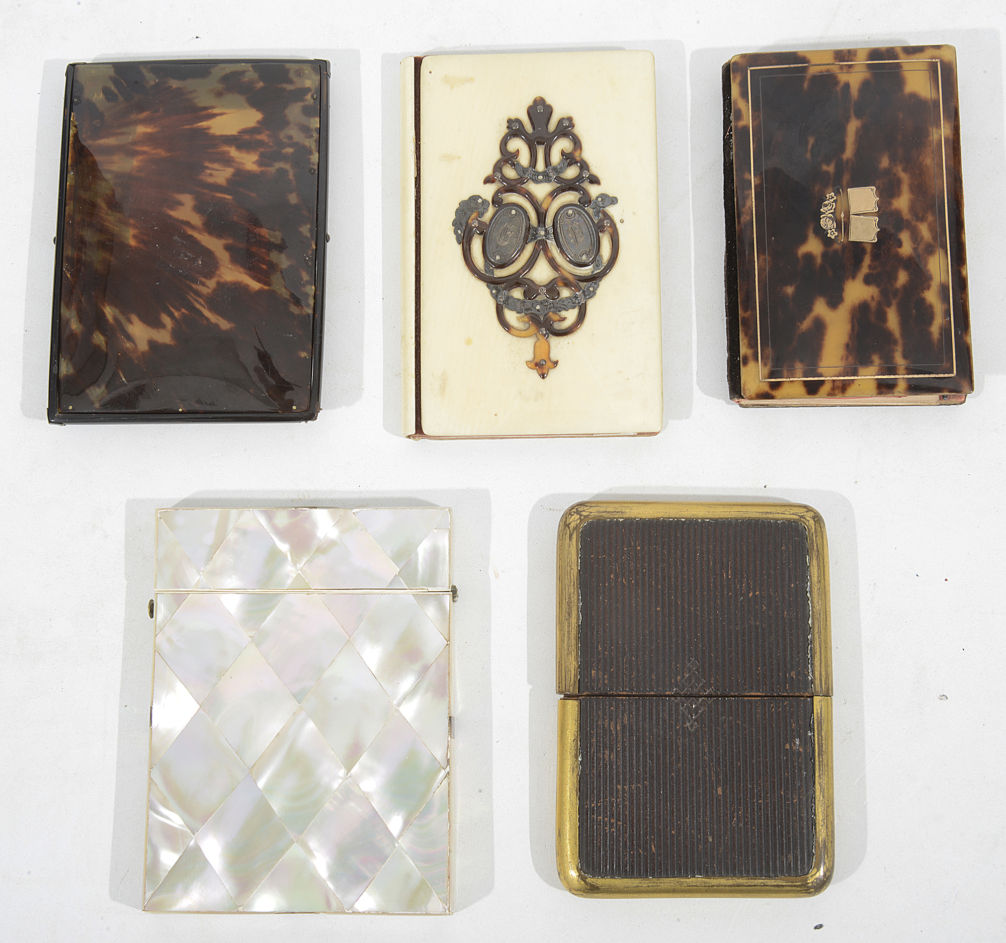 A Victorian mother of pearl card case together with two aide memories and two card cases