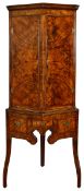 A George II burr walnut canted corner cupboard on stand