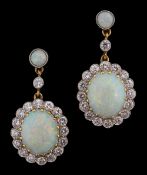 A pair of opal and diamond-set ear pendants