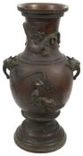 A Chinese patinated bronze two handled vase,