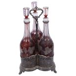 An early Victorian electroplated three bottle decanter stand