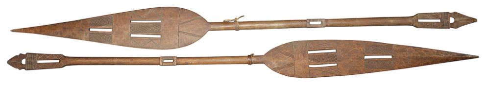 Two early 20th century Nigerian tribal carved hardwood ceremonial paddles