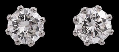 A pair of diamond single stone ear studs