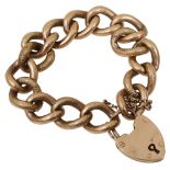 A 9ct curb link bracelet with heart locket
