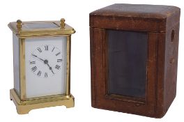 An early 20th century gilt brass cased carriage clock in a leather case