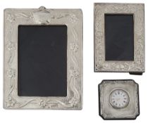 Two modern silver photograph frames and a silver fronted desk clock