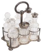 A late 19th century Indian Colonial silver six bottle cruet frame