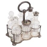 A late 19th century Indian Colonial silver six bottle cruet frame