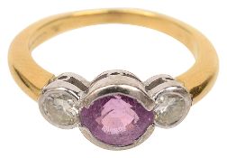 A pink sapphire and two stone diamond ring