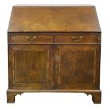 A George III figured mahogany bureau