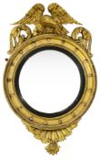 A Regency giltwood and gesso convex wall mirror