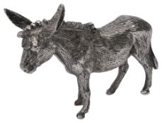A naturalistically cast silver figure of a standing donkey