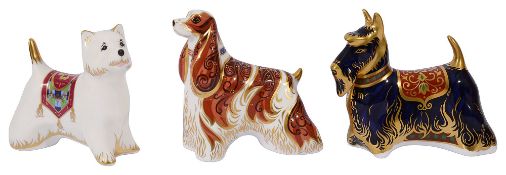 Three Royal Crown Derby paperweights of dogs