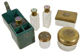 A leather cased set of three scent bottles and a set of jars with owl lids