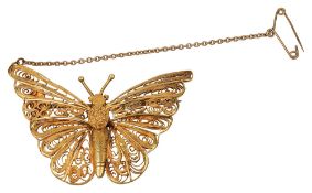 A filigree work butterfly brooch
