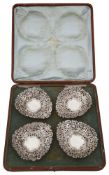 A cased set of four Edwardian silver bonbon dishes
