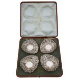 A cased set of four Edwardian silver bonbon dishes