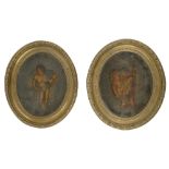 A pair of early 19th century oval wax relief pictures of putti with garlands
