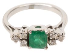 An emerald and diamond-set ring