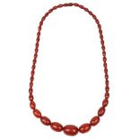 An amber graduated oval bead necklace