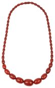 An amber graduated oval bead necklace