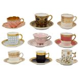 A collection of nine demi tasse coffee cups and saucers