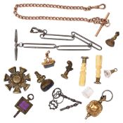 A collection of early 19th century and later fobs, watch keys, seals and a steel watch chain