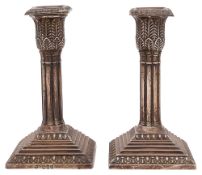 A pair of late Victorian silver dwarf candlesticks