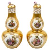 A pair of porcelain double gourd vases and covers,