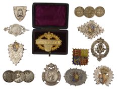 A collection of mostly silver and enamel Queen Victoria 1887 Golden Jubilee commemorative brooches