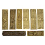 A set of seven closed trellis brass door fingers plates and two others