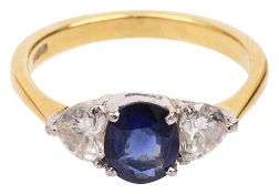 A sapphire and diamond three stone ring