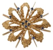 A 1960s sapphire-set flowerhead brooch