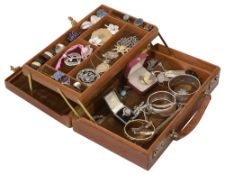 A leather jewellery box containing a collection of costume jewellery