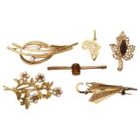 A small collection of assorted 18ct and 9ct brooches and pendant