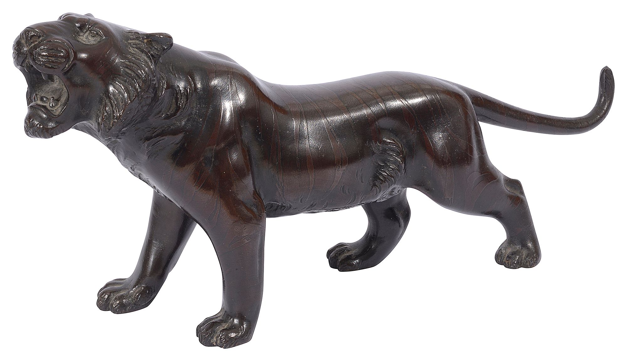 A Japanese Meiji period patinated bronze figure of a stalking tiger