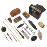 A mid 19th century French leather cased etui and a collection of scent bottle and sewing items