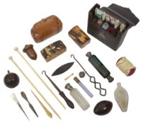 A mid 19th century French leather cased etui and a collection of scent bottle and sewing items