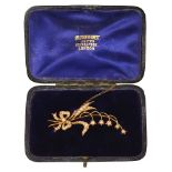 An Edwardian seed pearl and gold lily of the valley brooch