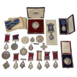 A collection of Victorian and later silver and other prize medals and medallions