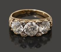 A late Victorian three stone diamond set ring