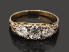 A late Victorian diamond three stone ring
