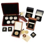 A selection of cased gold and silver proof coins