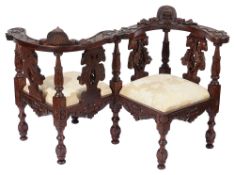 A late 19th century Italian carved walnut dolls conversation chair