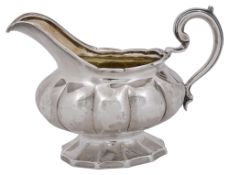 A George IV silver melon form cream jug