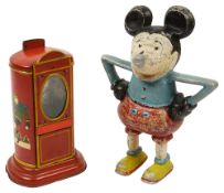 A Mickey Mouse money box together with a German chocolate dispenser box, 1930s