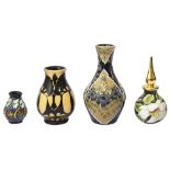 A Moorcroft perfume bottle, two small vases and a miniature vase