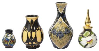 A Moorcroft perfume bottle, two small vases and a miniature vase